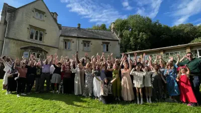 Graduates celebrating outside Hawkwood College